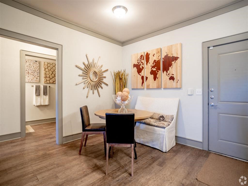 a dining room with a table and a chair