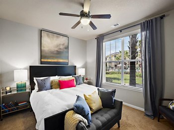 Bedroom With Expansive Windows Bedroom With Expansive Windows at Century Crosstown Apartments, Tampa, Florida, 33619 - Photo Gallery 4