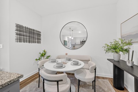 Contemporary kitchen featuring pendant lights, generous storage, and a dining alcove at Farmhouse Apartments in Murfreesboro, Tennessee.