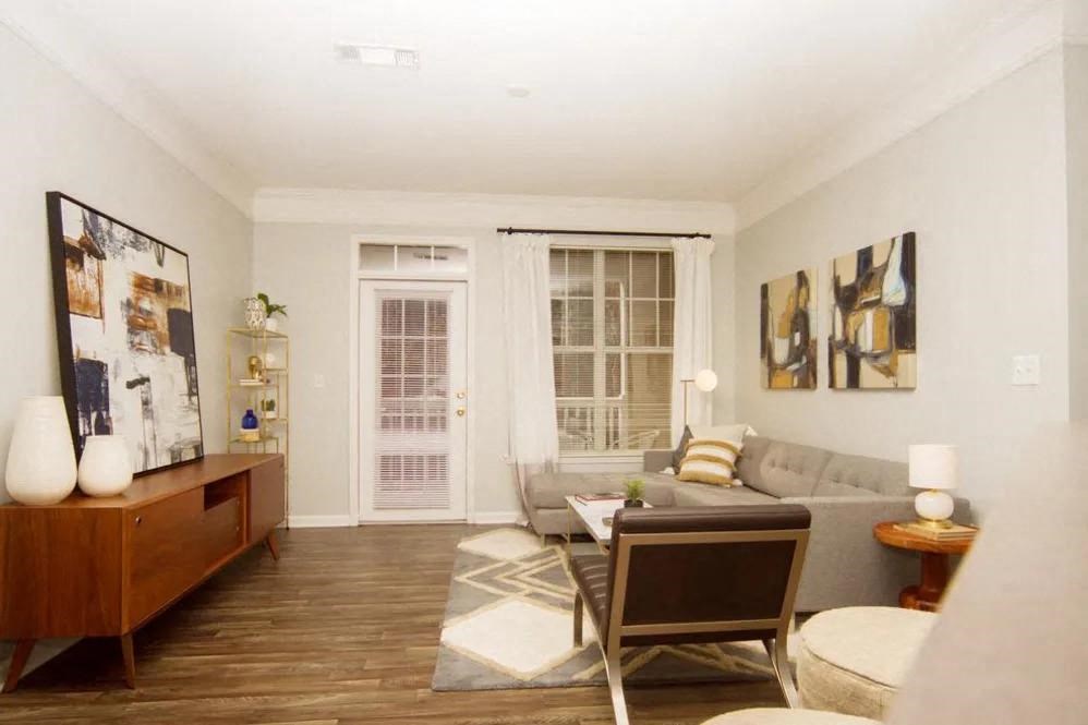 Spacious living room with wood-like flooring Dakota Mill Creek Buford, GA