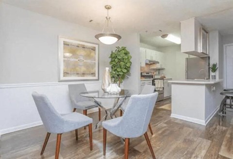 a dining room and kitchen with a table and chairs at The Sapphire, Decatur, GA, 30035