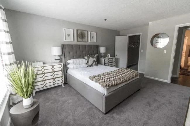 a bedroom with a large bed and a mirror at The Sapphire, Georgia