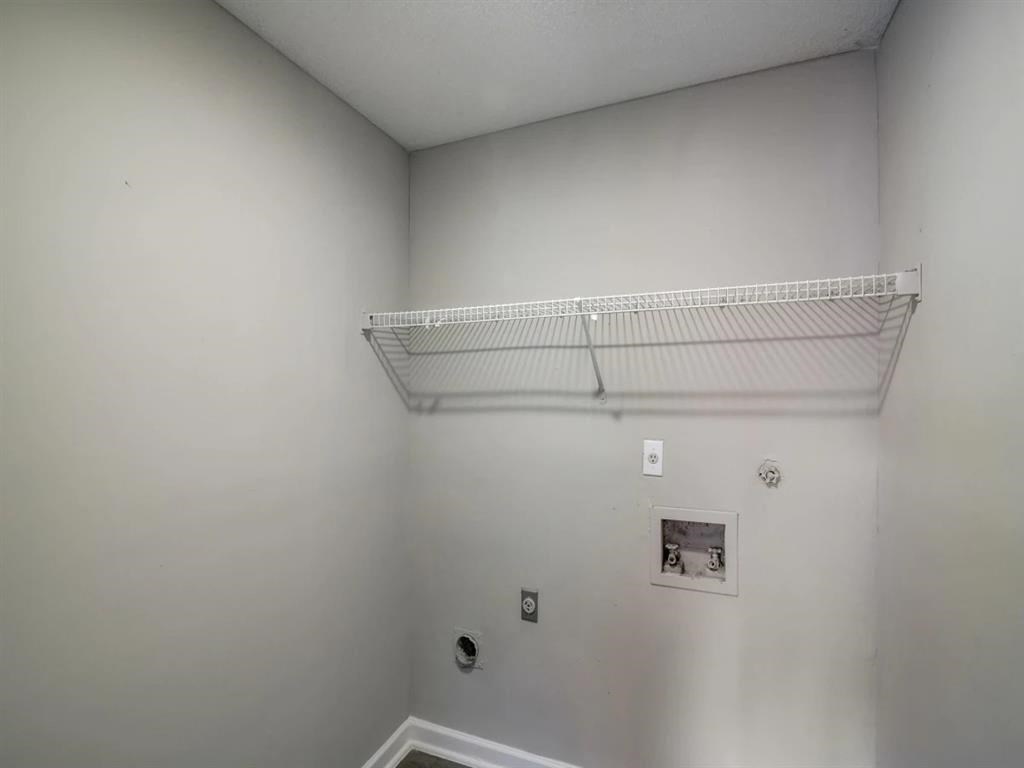 a empty room with a shelf on the wall at The Sapphire, Georgia, 30035