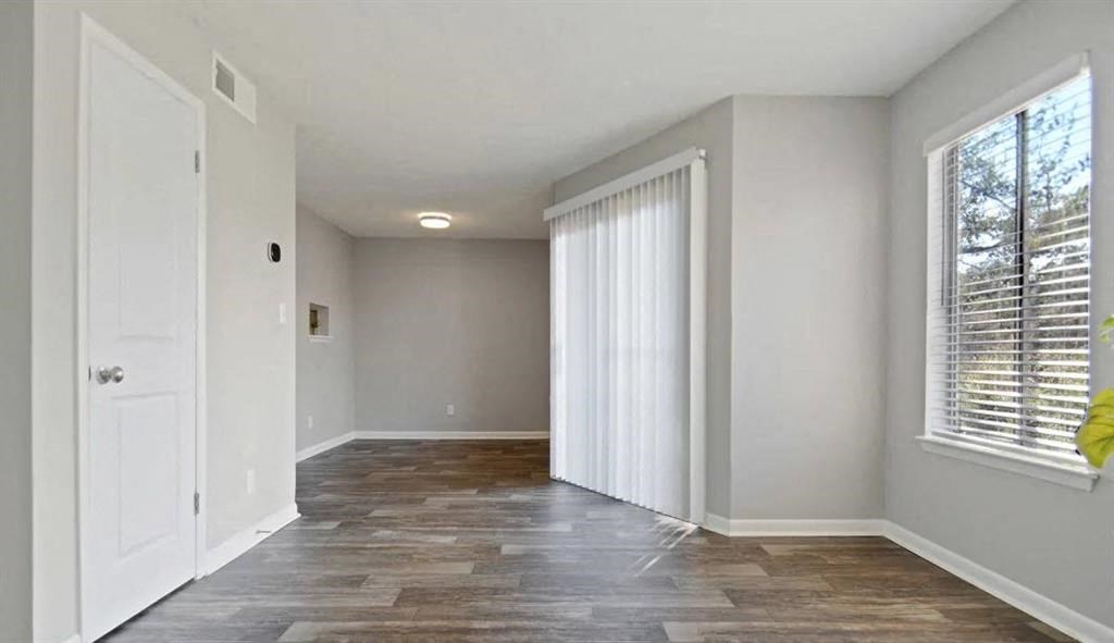 Bedroom With Expansive Windows at The Landing At Pleasantdale, Doraville, Georgia