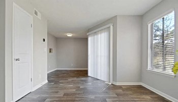 Bedroom With Expansive Windows Bedroom With Expansive Windows at The Landing At Pleasantdale, Doraville, Georgia - Photo Gallery 4