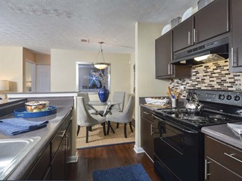 kitchen with black appliances at Harvard Place Apartments, Lithonia, GA, 30058 - Photo Gallery 30