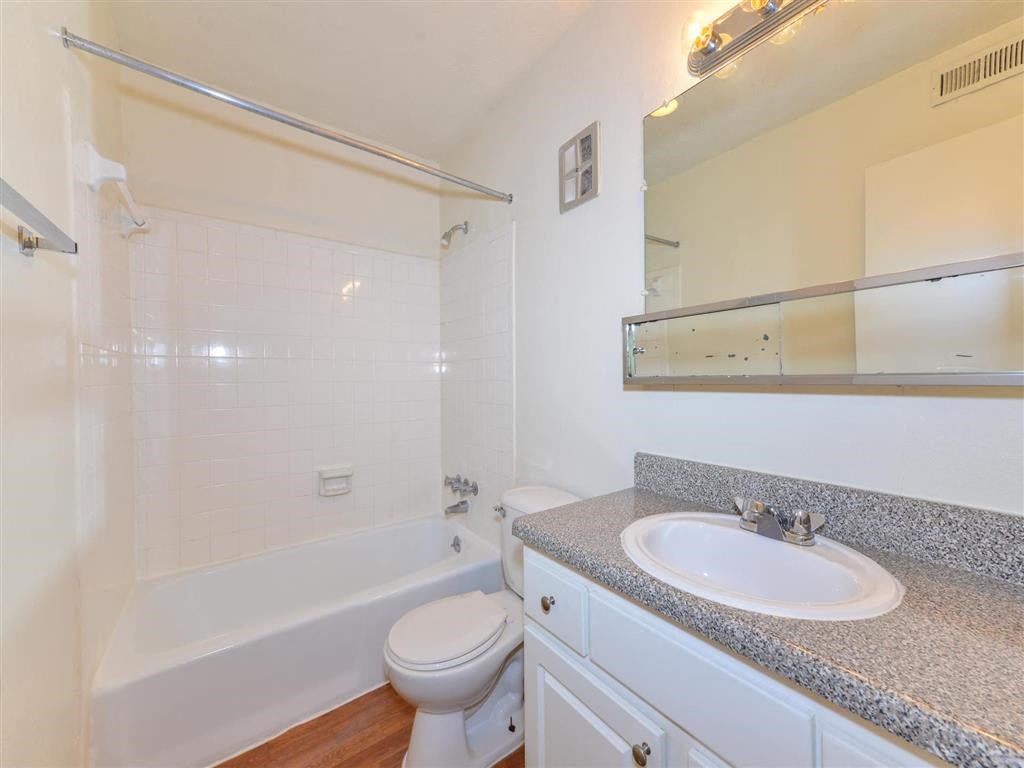 a bathroom with a sink toilet and a bath tub