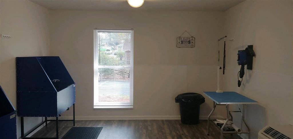 a room with a piano and a table in it