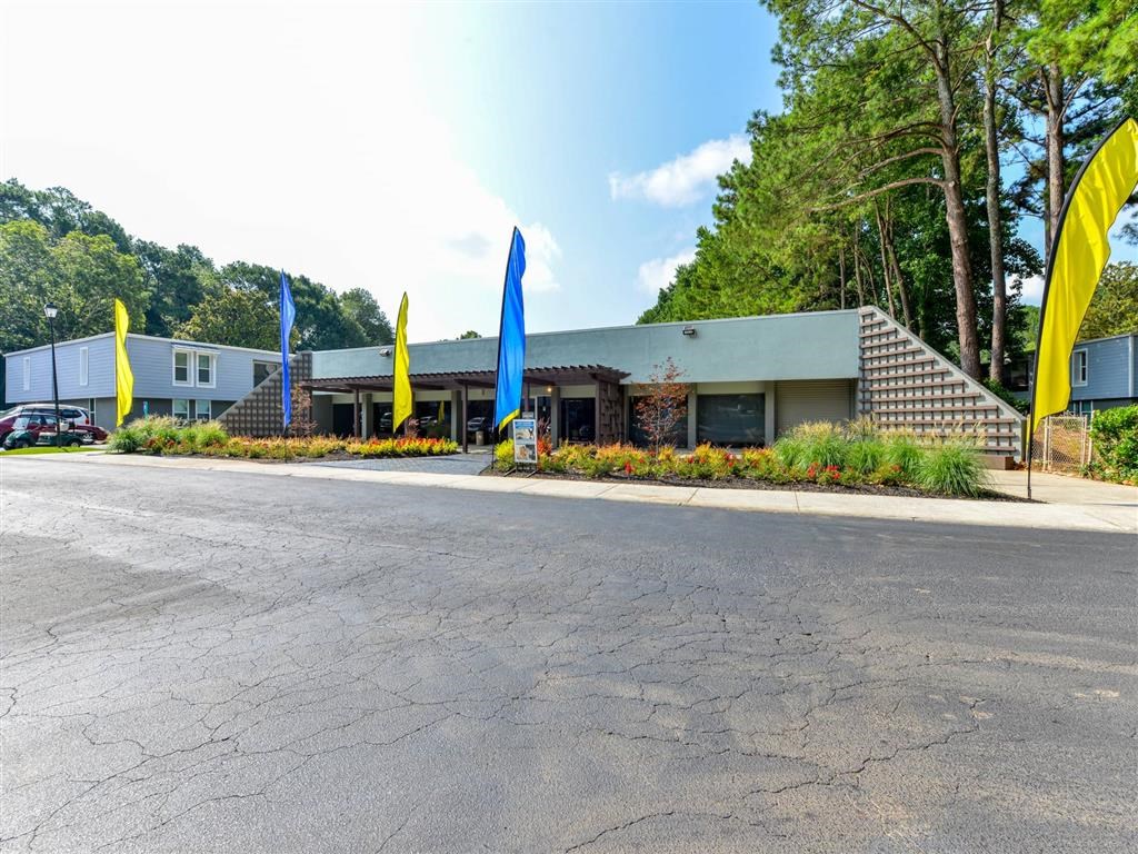 a building with yellow and blue flags in front of it