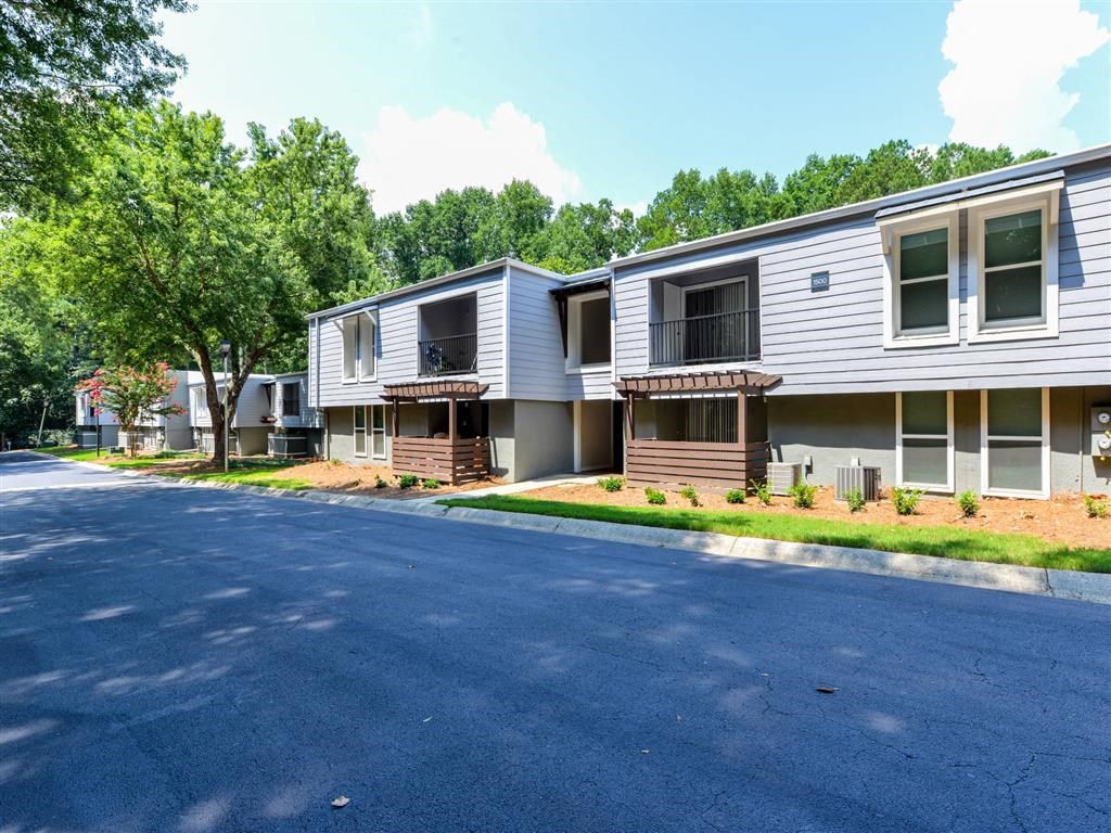 a row of houses on the side of a road
