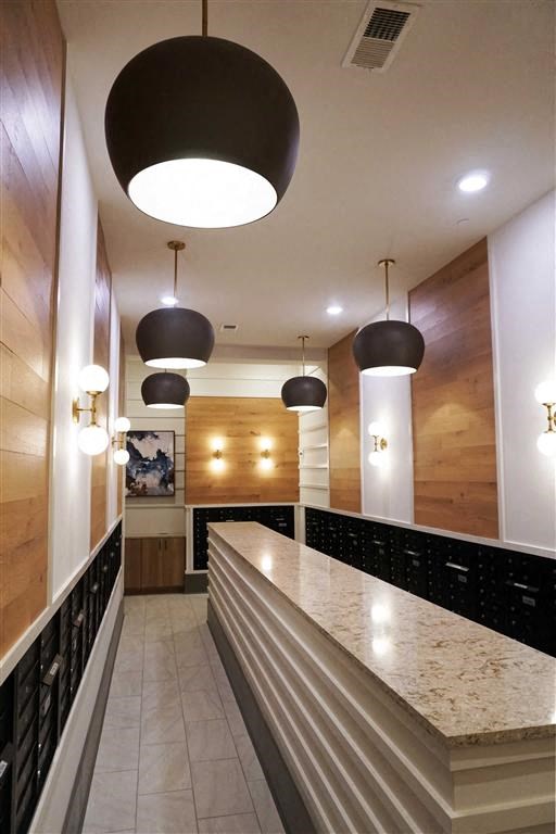 a long counter top in a room with lights