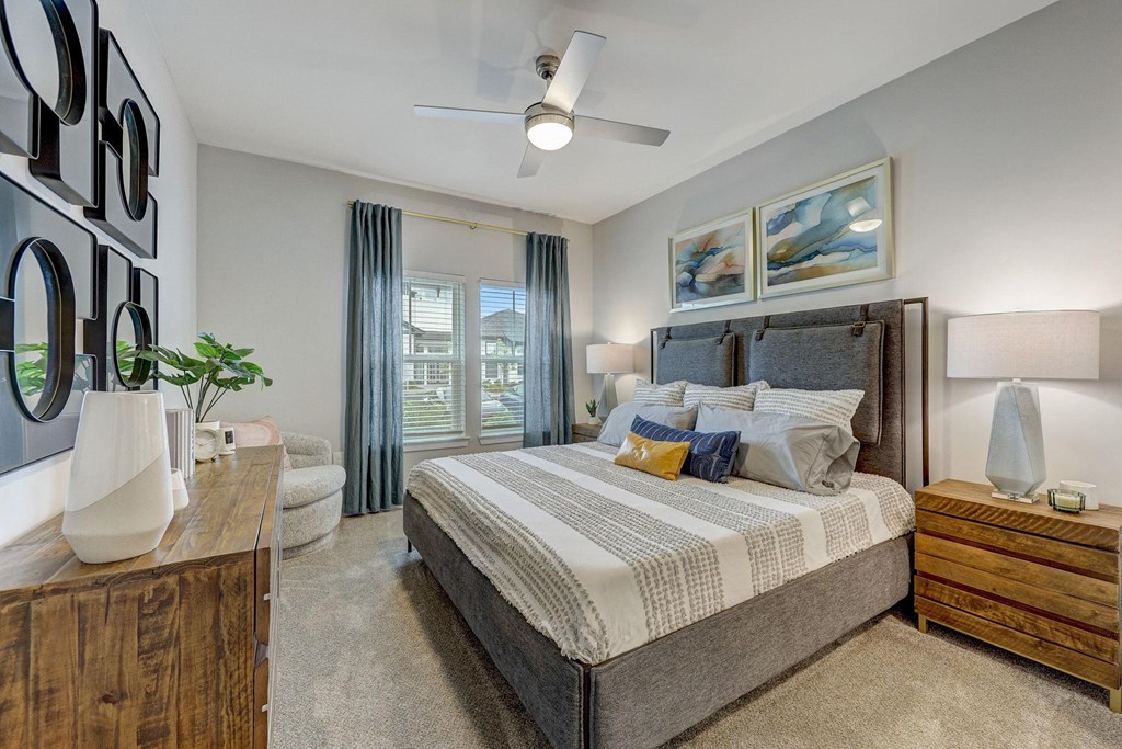 a bedroom with a bed and a window at Century Mundy Mill Apartments, Georgia 30566