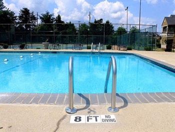 Sparkling swimming pool with sundeck at the Ascend at Stone Mountain