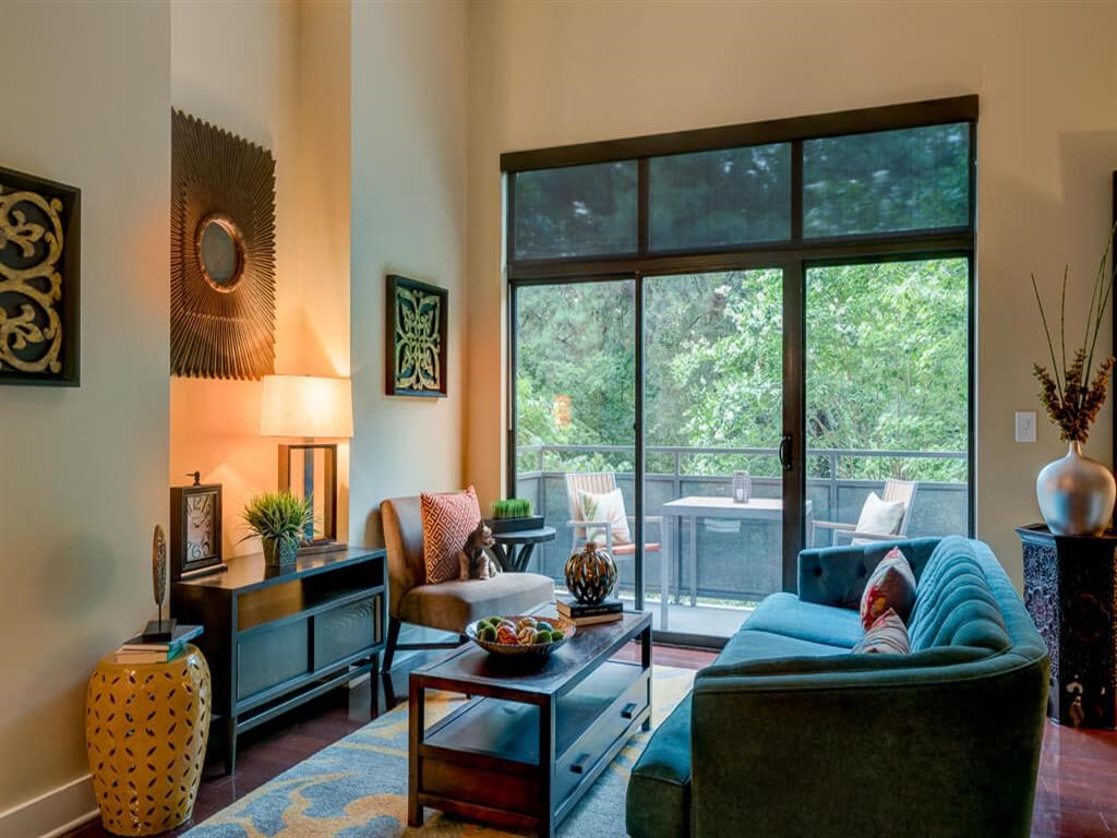a living room with a couch and a large window