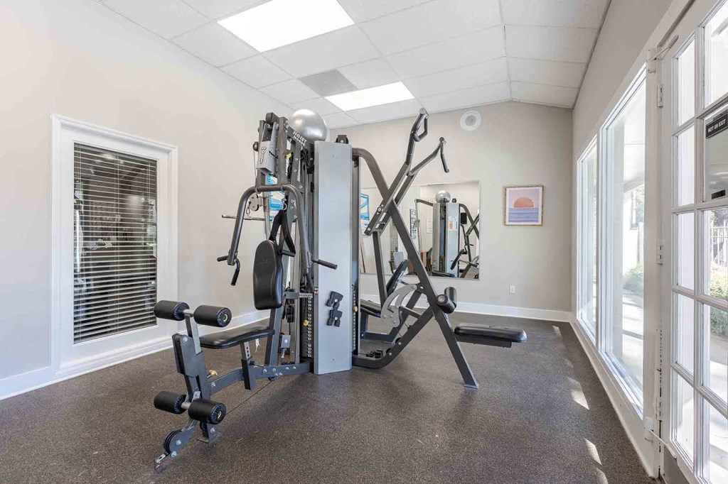 A well-equipped gym with a variety of machines and weights. at Grove at St. Andrews, Columbia, 29210