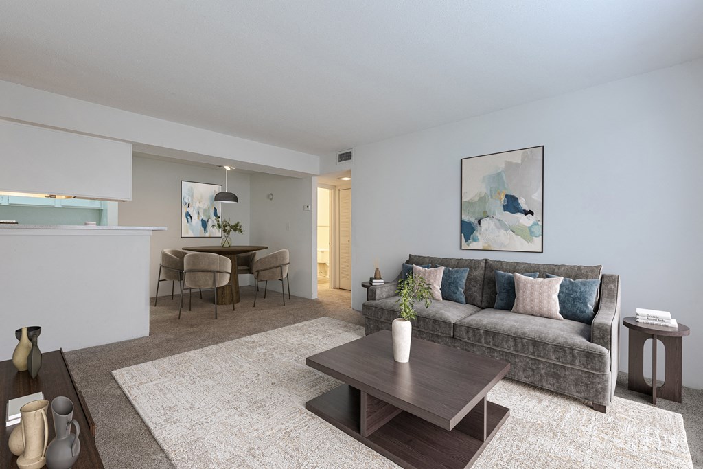 A living room with a grey couch and a coffee table in the middle. at Grove at St. Andrews, Columbia, 29210
