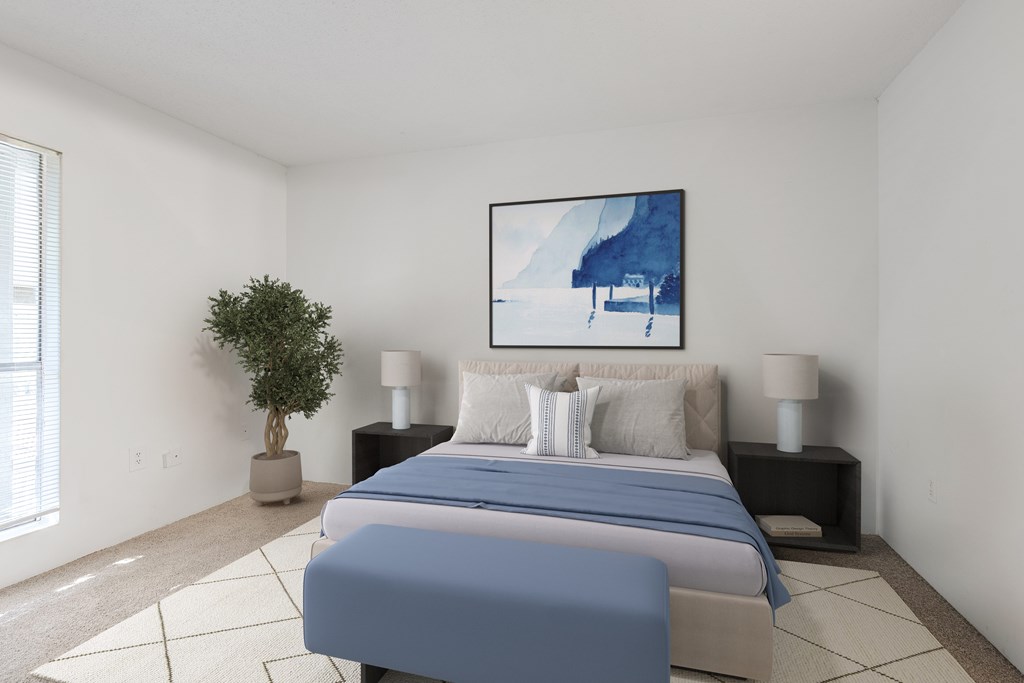 A bedroom with a large bed and a painting on the wall. at Grove at St. Andrews, Columbia, SC, 29210