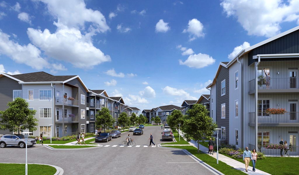 A street view of a residential area with cars and buildings.