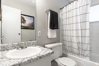 a bathroom with a sink toilet and bathtub - Photo Gallery