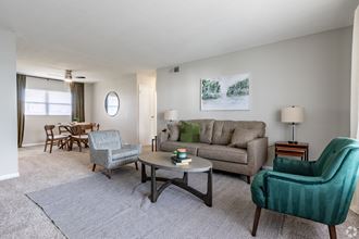 our apartments offer a living room with a sofa coffee table and dining table - Photo Gallery
