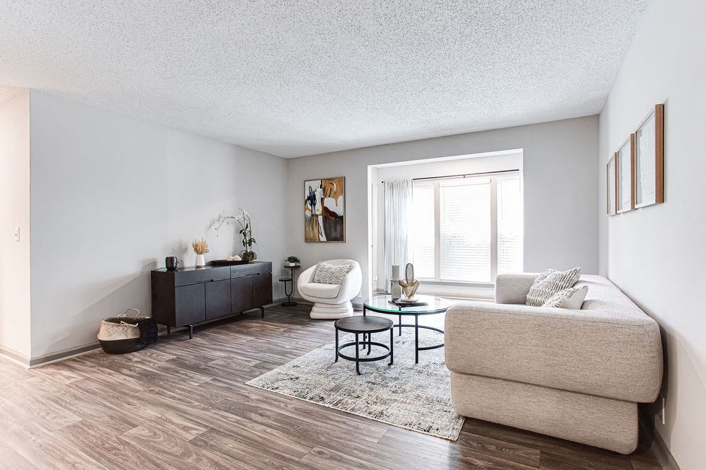 a living room with white walls and hardwood flooring at Hidden Lake, Union City, GA
