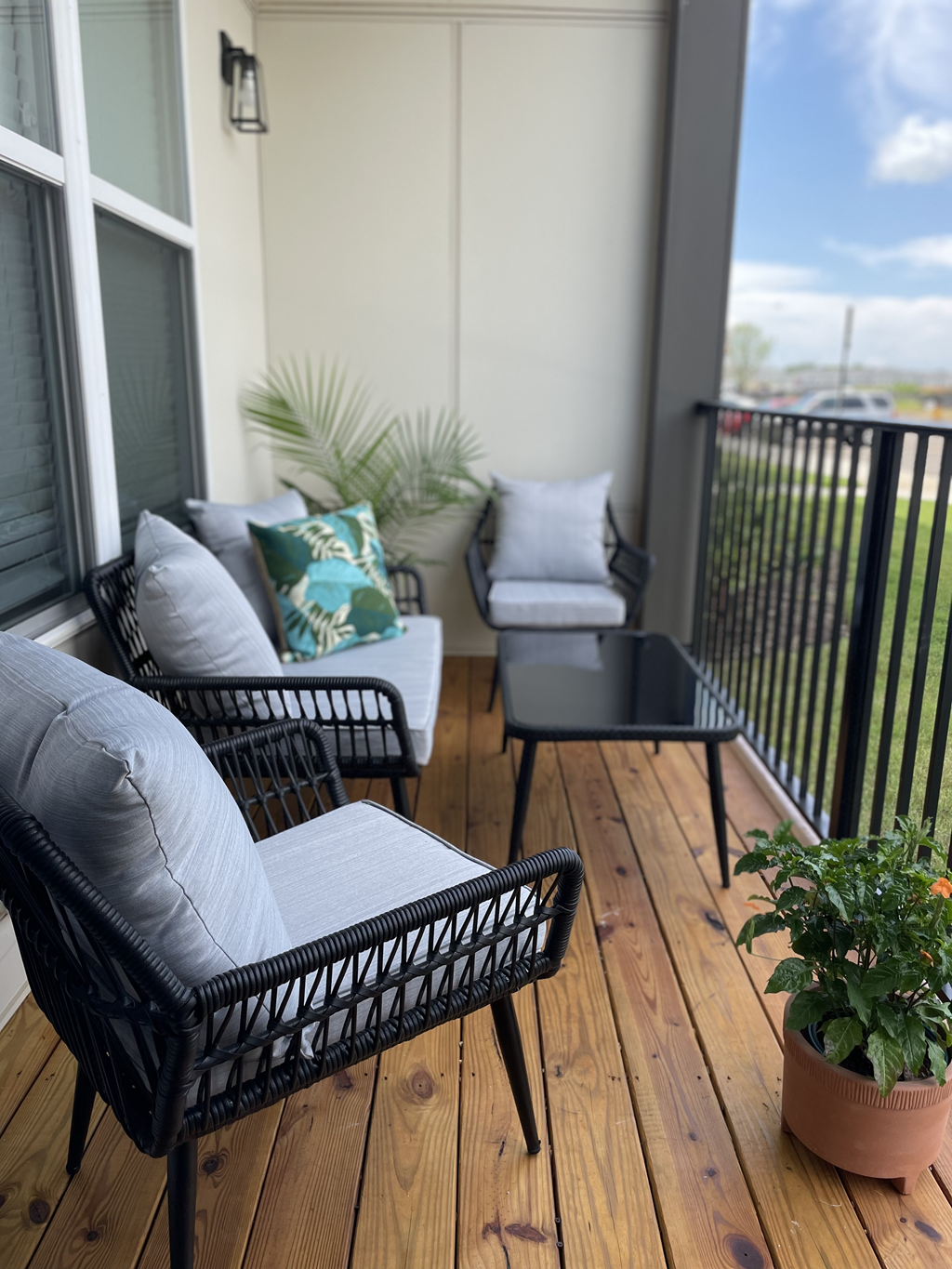 a patio with wicker furniture and a potted plant at The Cannon, Murfreesboro, TN 37130