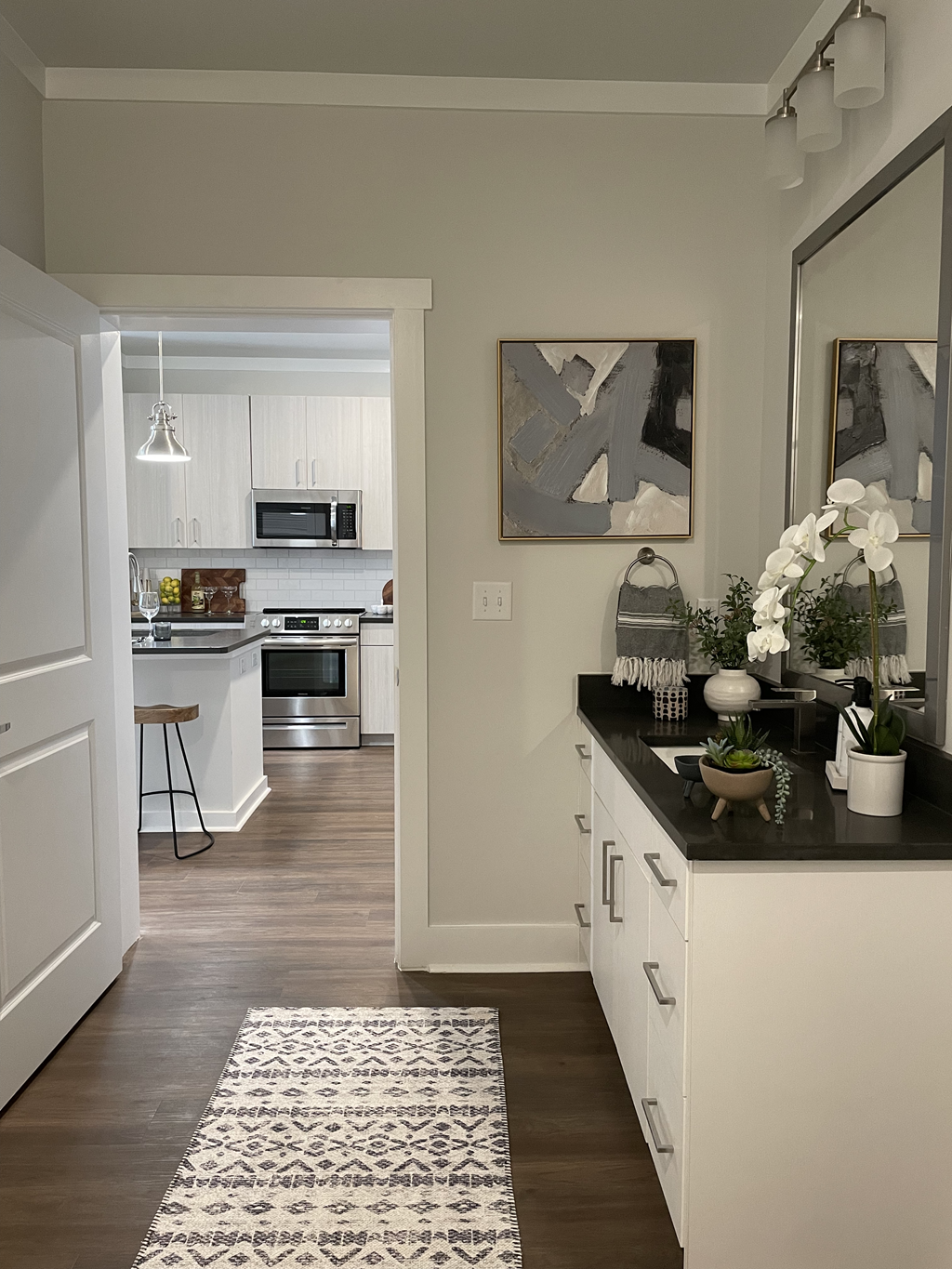 a kitchen with white cabinets and a black counter top at The Cannon, Tennessee, 37130
