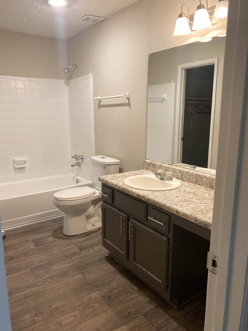 a bathroom with a sink toilet and a bath tub