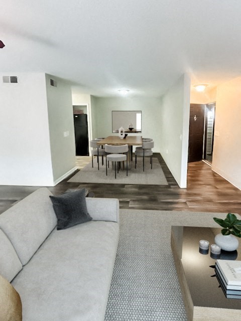 a living room and dining room with a couch and a table