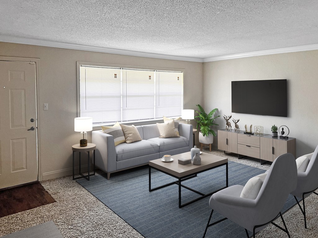 a living room with a couch and a table and a tv