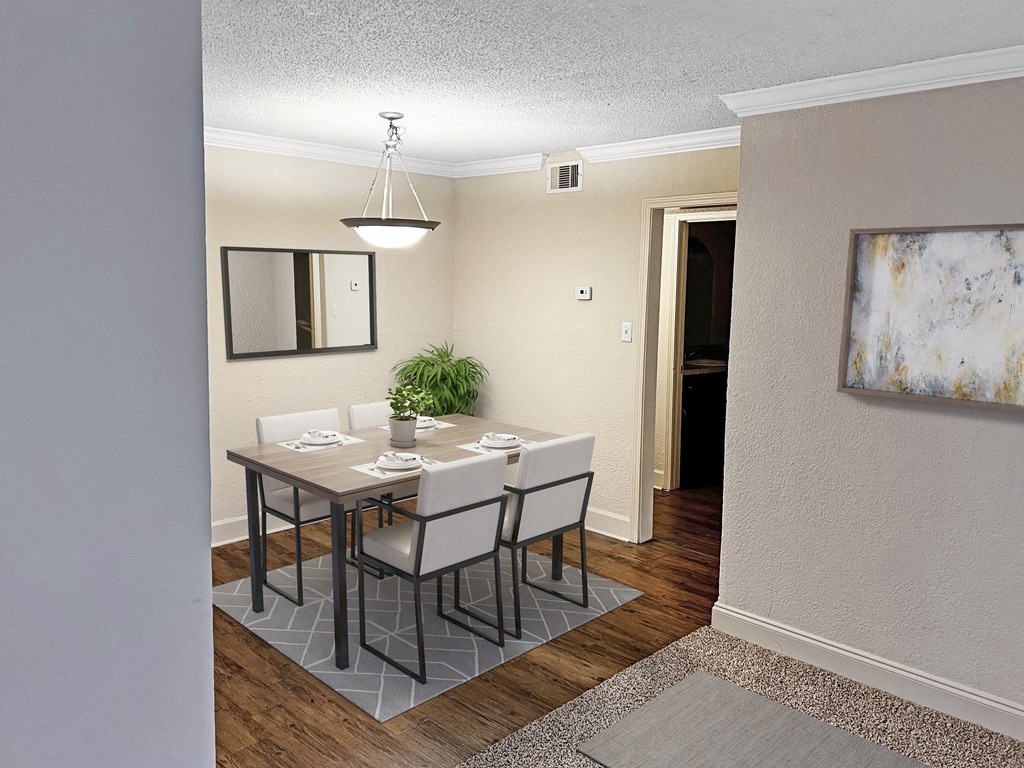 an image of a dining room with a table and chairs