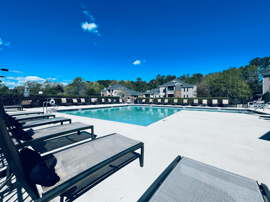 sparkling swimming pool with lounge chairs at Palmetto Place, South Carolina, 29708