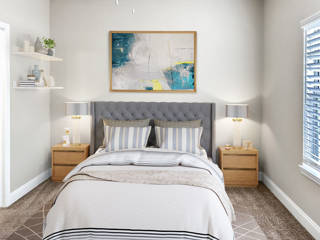 a bedroom with a bed and two lamps and a painting on the wall