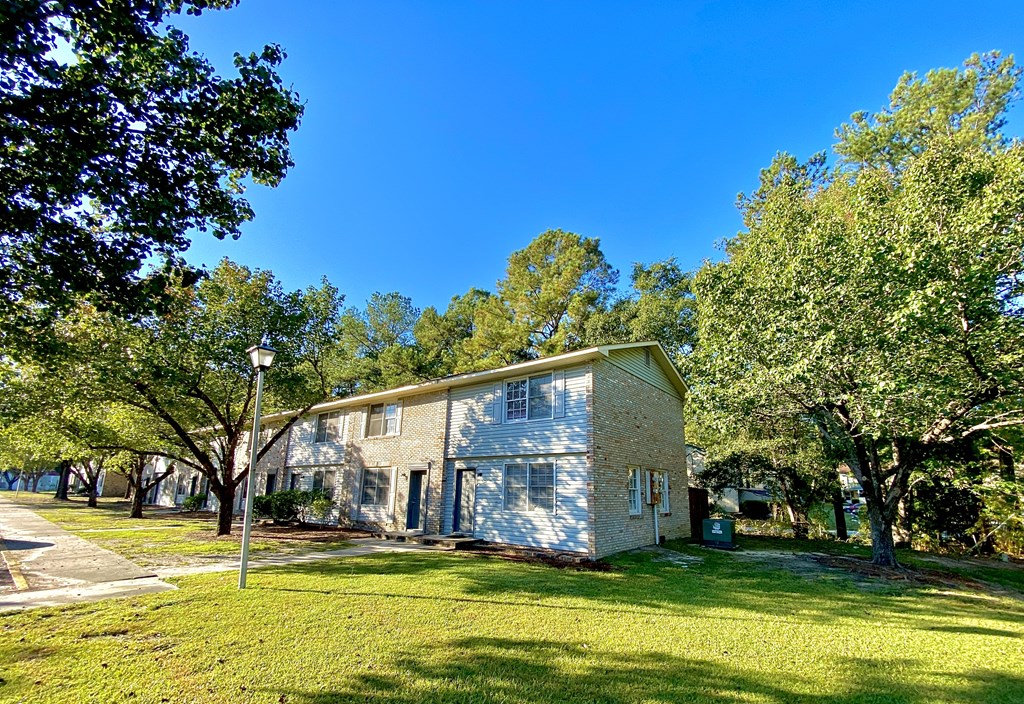 exterior building view with greenery at The Retreat @ St. Andrews Apartments by ICER, Columbia, SC