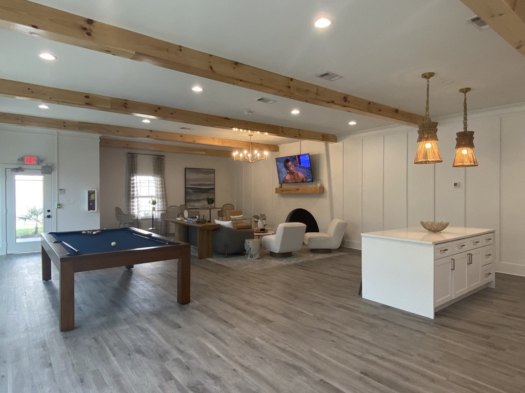 a rec room with a pool table and a tv at Crescent Place Apartments, Georgia