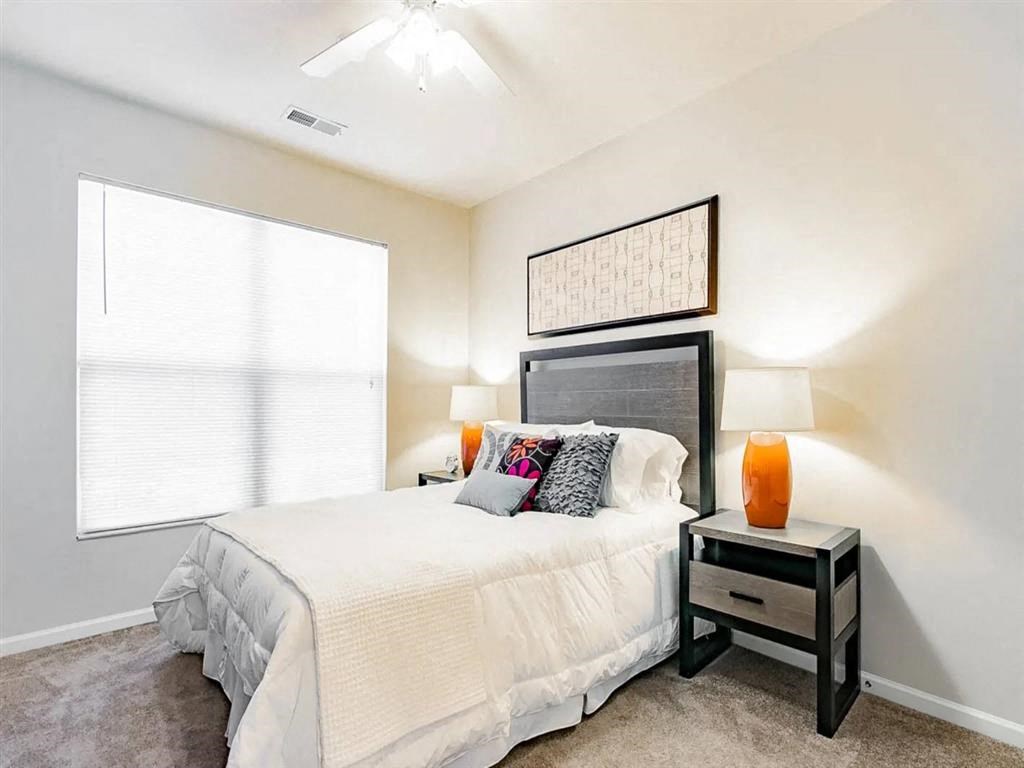 Bedroom With Expansive Windows at Elevate on Main, Granger, Indiana