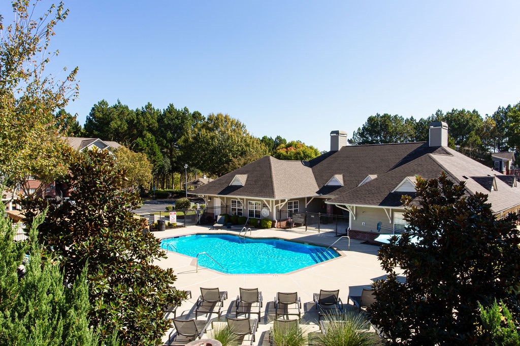 a large swimming pool in front of a house a large swimming pool in front of a house at Indigo Apartments Gainesville, Gainesville, GA 30504