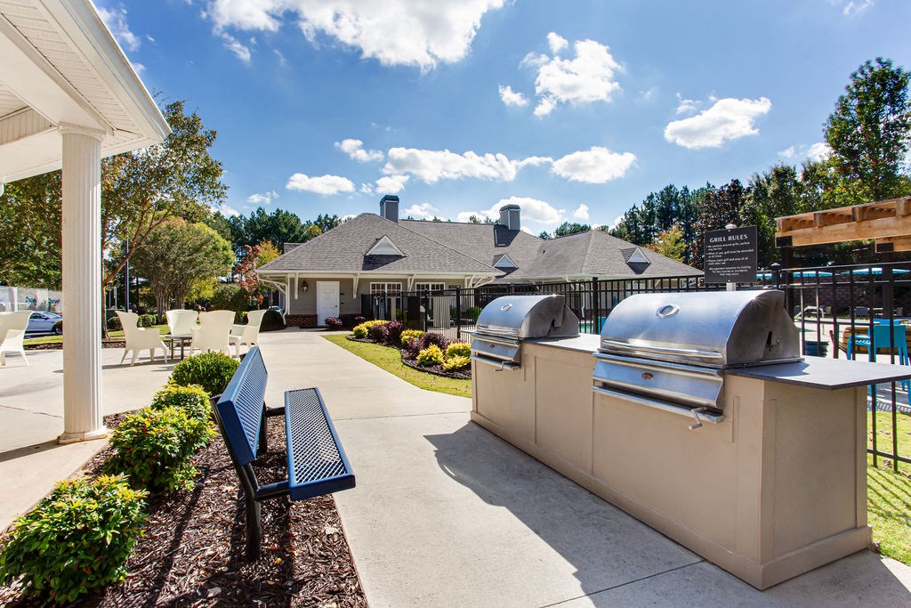 the preserve at ballantyne commons community patio with two bbq grills at Indigo Apartments Gainesville, Gainesville, 30504