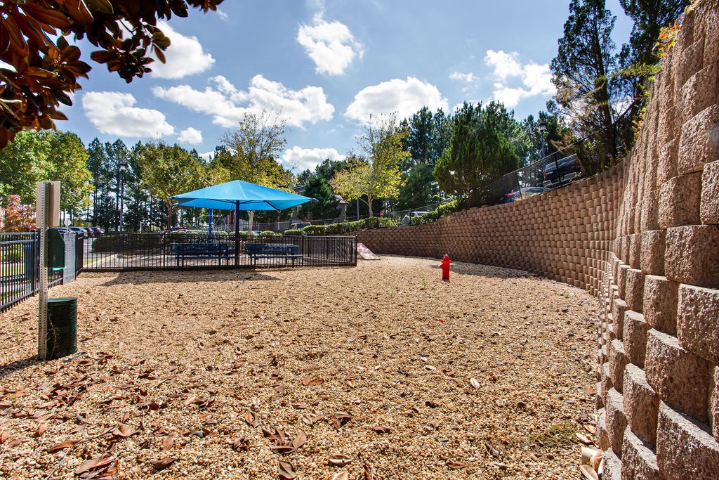 a dog park with a fence and a fire hydrant at Indigo Apartments Gainesville, Gainesville, GA