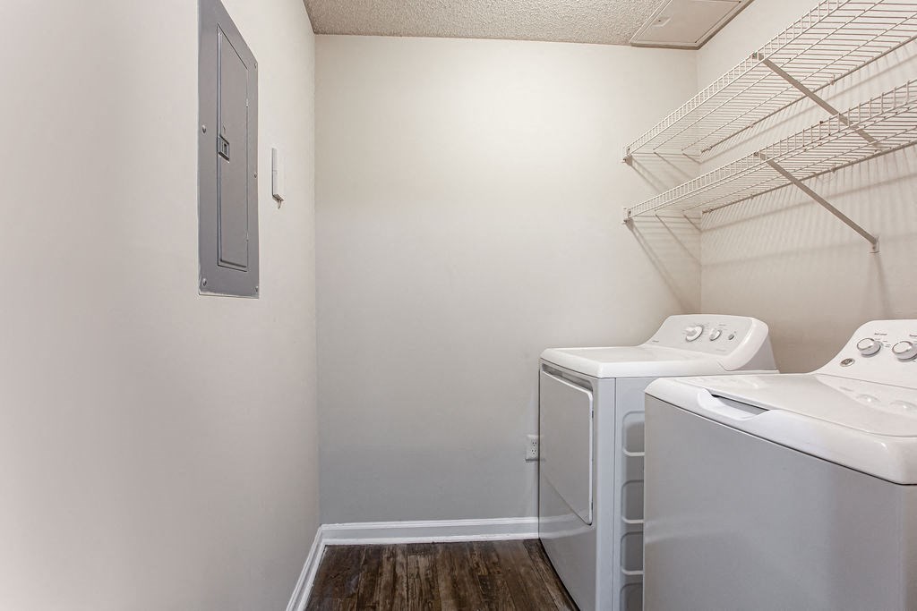 a washer and dryer in a laundry room with a closet at Indigo Apartments Gainesville, Gainesville, 30504