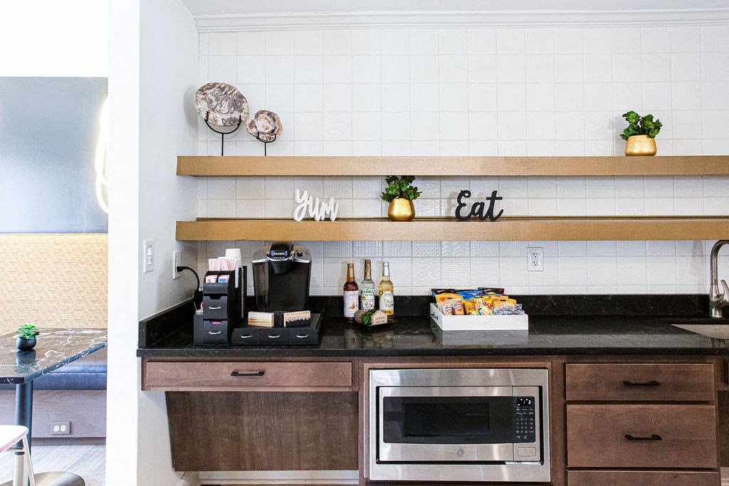 a kitchen with a counter top and a microwave at Indigo Apartments Gainesville, Georgia