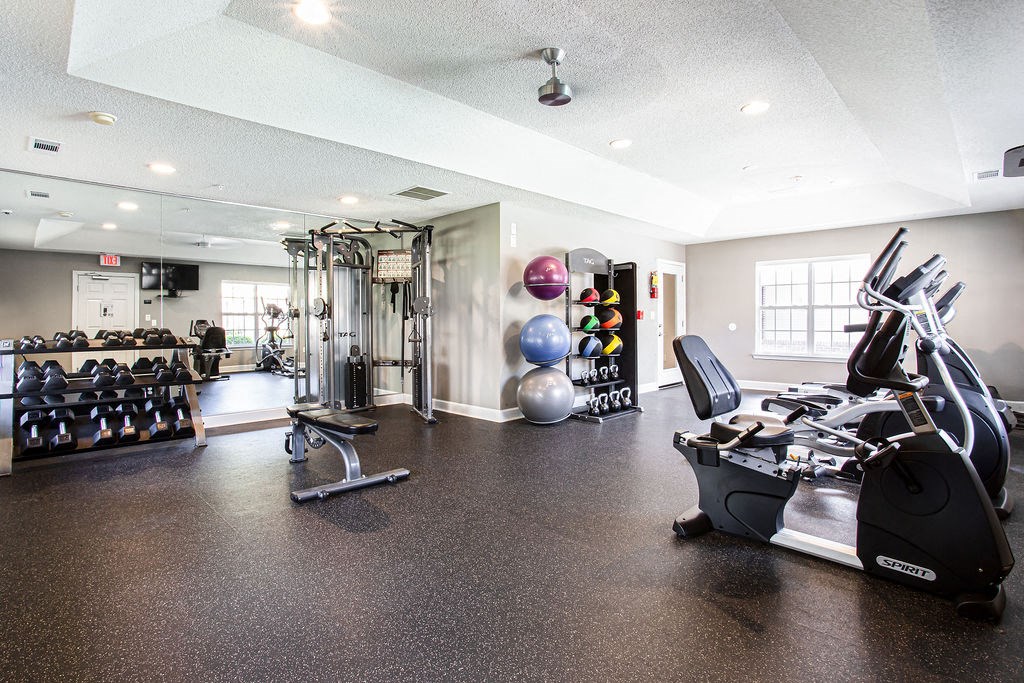 the gym at the district at highland village apartments at Indigo Apartments Gainesville, Gainesville, GA 30504
