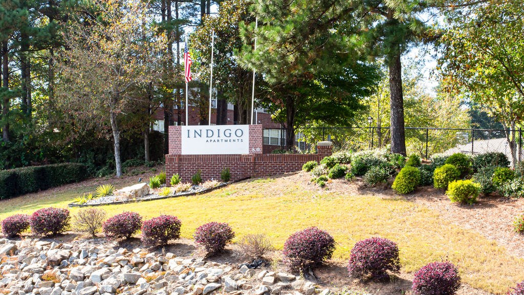 a view of the indio welcome sign in front of a brick building with trees at Emery Village, Georgia, 30504