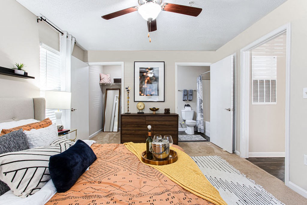 a bedroom with a bed and a ceiling fan at Indigo Apartments Gainesville, Gainesville, GA 30504