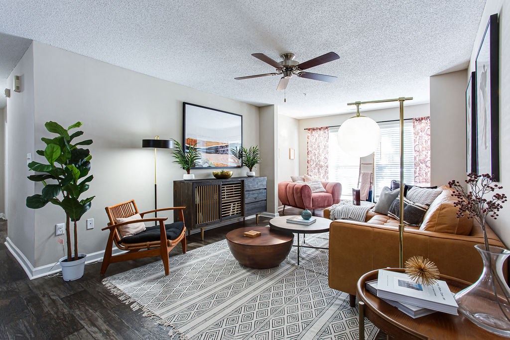 a living room with furniture and a ceiling fan at Indigo Apartments Gainesville, Gainesville Georgia