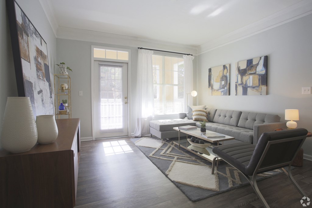 Model living room with large windows Dakota Mill Creek Buford, GA