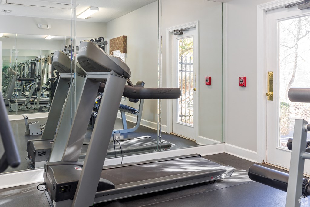 the gym is equipped with a treadmill and other exercise equipment