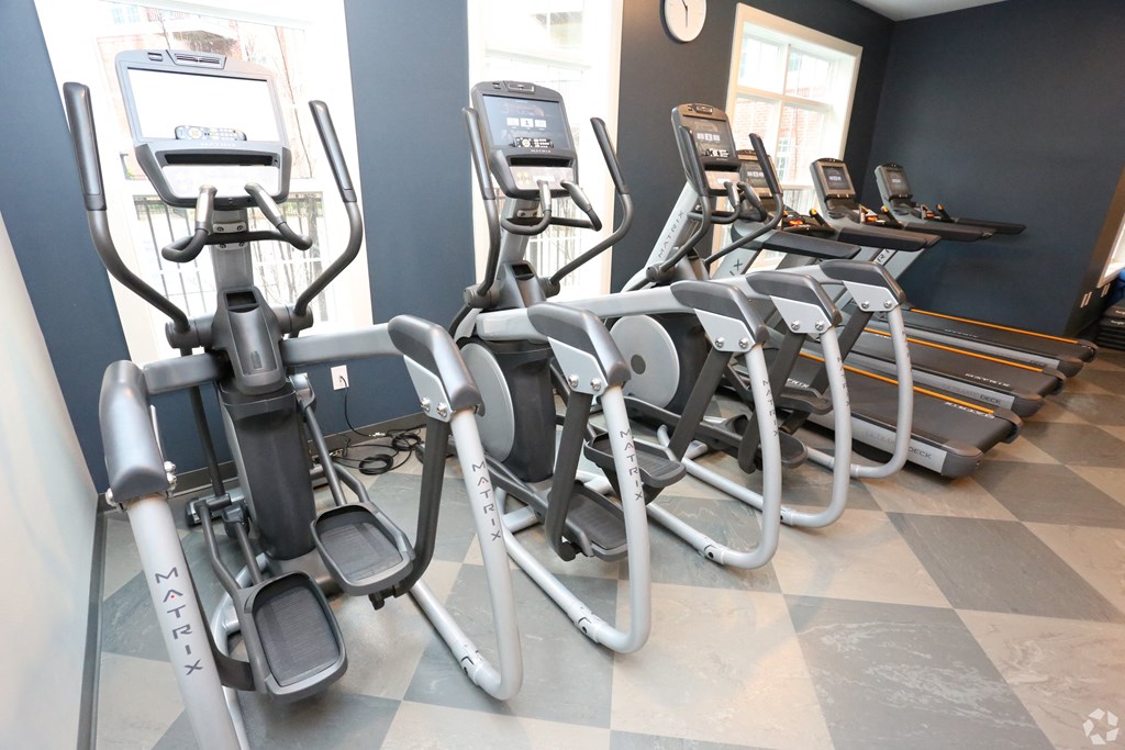 a row of exercise bikes in a gym at Century Baxter Avenue, Louisville Kentucky