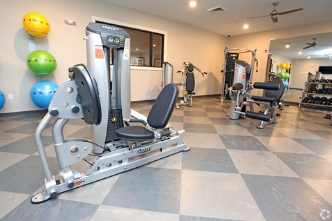 a gym with cardio equipment and weights in a home gym at Century Baxter Avenue, Louisville, 40204