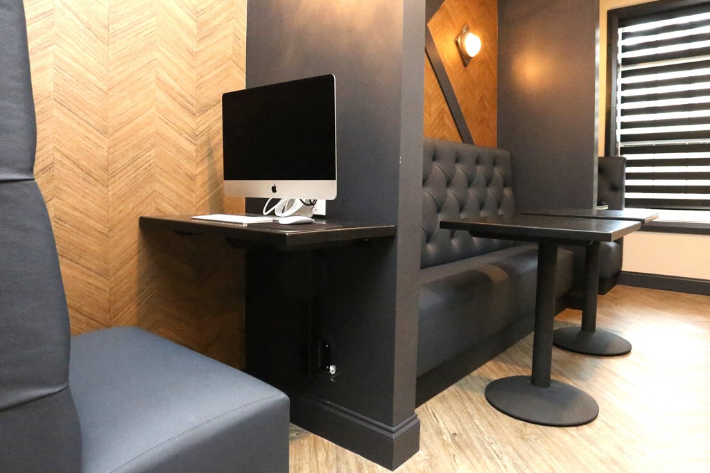 a desk with a computer and a chair in a room at Century Baxter Avenue, Kentucky, 40204